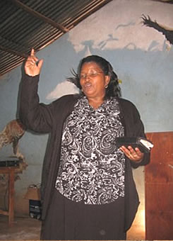 Founder Director Mrs. Margret Kimuyu educating some of the slum dwellers during a seminar.